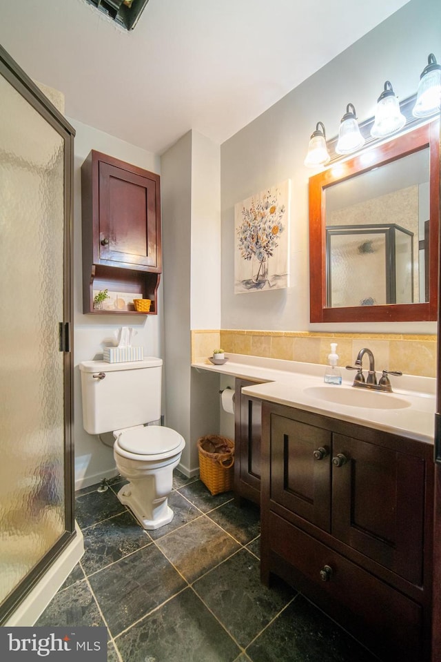 bathroom featuring a stall shower, visible vents, vanity, and toilet