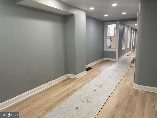 hallway with light wood-type flooring