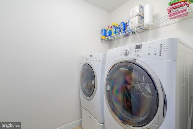 washroom with washing machine and dryer