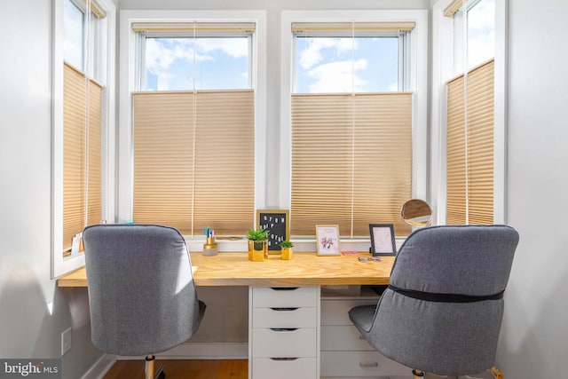 office area with a wealth of natural light and built in desk