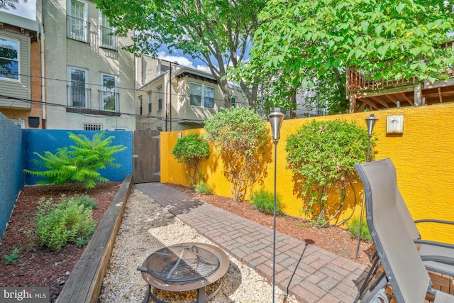 view of patio featuring an outdoor fire pit