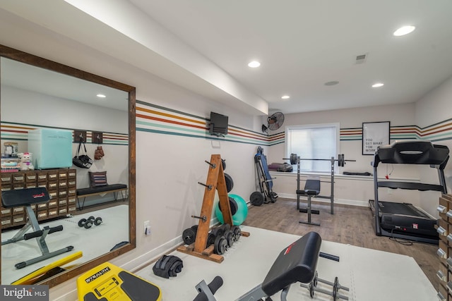 exercise area featuring hardwood / wood-style floors