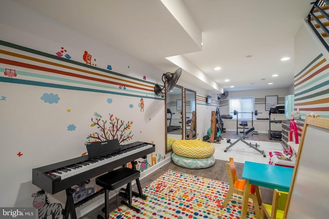 game room with hardwood / wood-style flooring