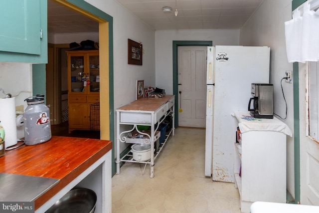 kitchen with freestanding refrigerator