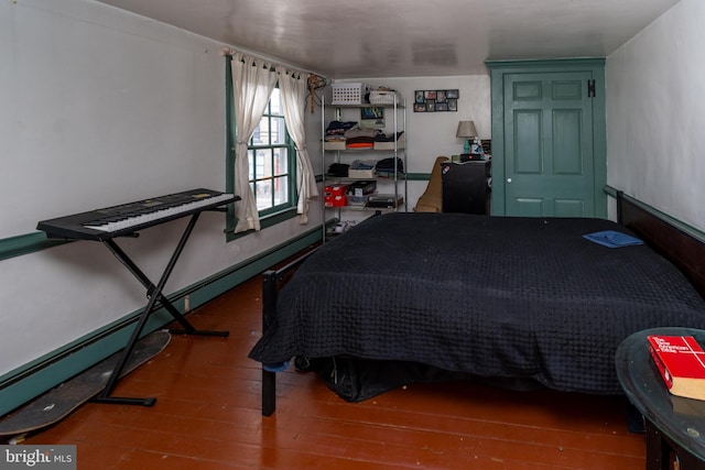 bedroom featuring wood finished floors