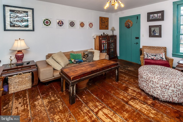 living room featuring an inviting chandelier and hardwood / wood-style flooring