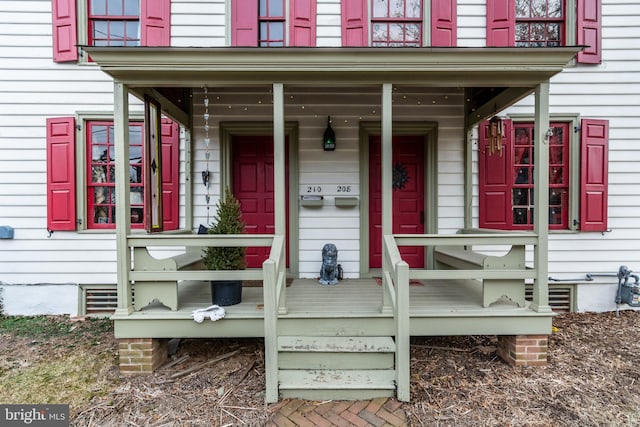 view of exterior entry featuring a porch