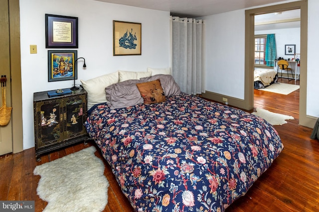 bedroom with wood finished floors