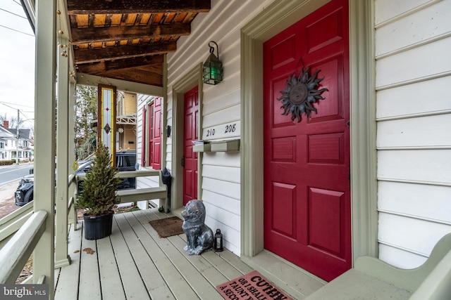 view of exterior entry with covered porch