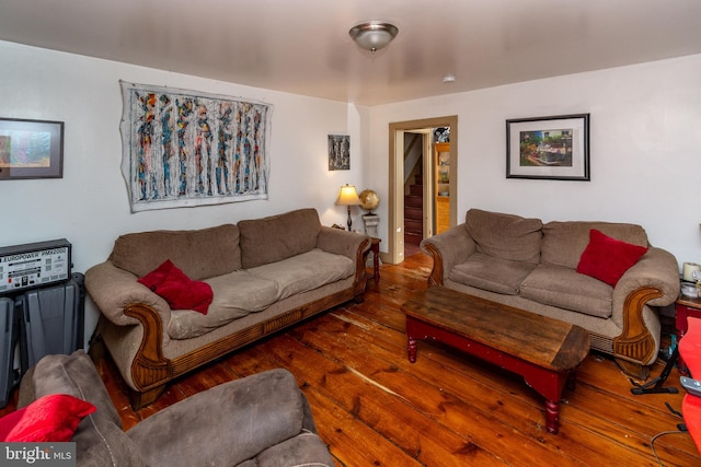 living room featuring hardwood / wood-style flooring and stairway