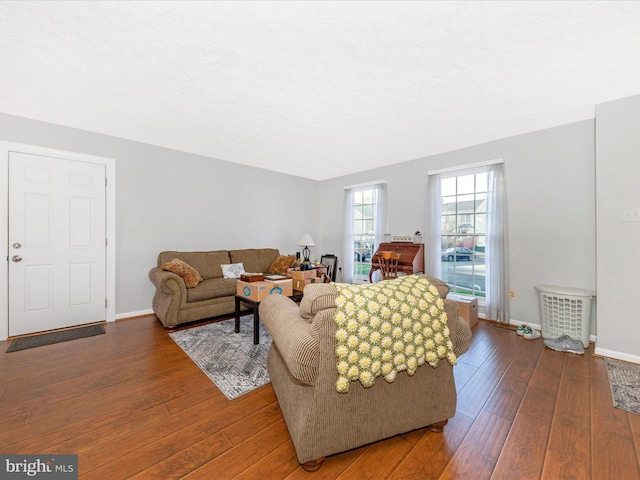 living room with baseboards and hardwood / wood-style flooring