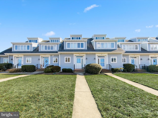 view of property with a front lawn