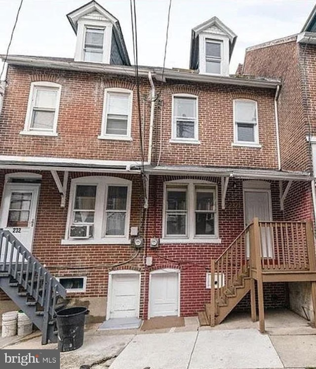 view of property with brick siding