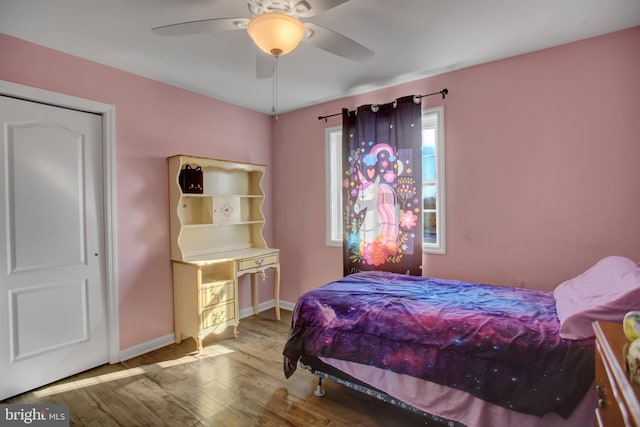 bedroom featuring hardwood / wood-style floors and ceiling fan