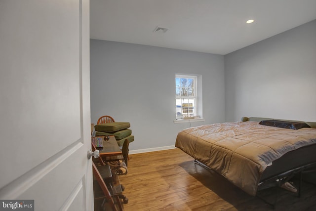 bedroom featuring light hardwood / wood-style floors