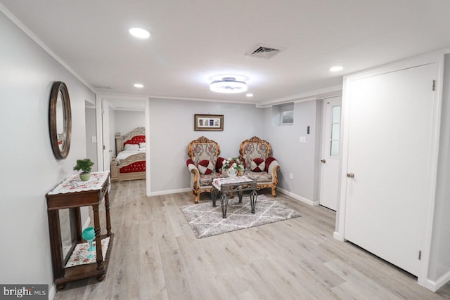 interior space featuring light wood-type flooring, visible vents, and baseboards