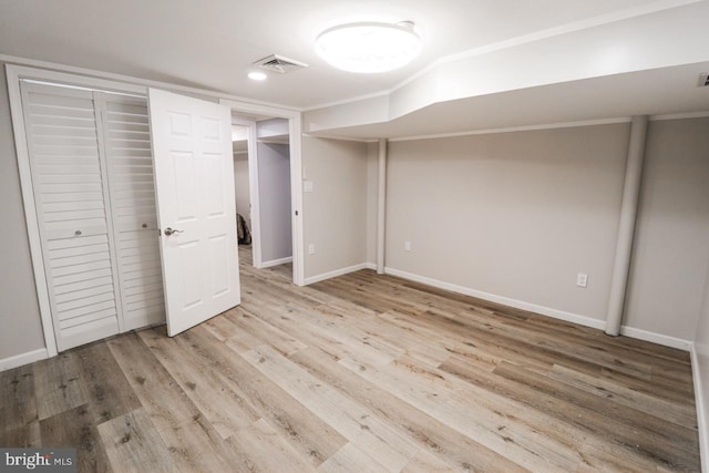 unfurnished bedroom featuring a closet, light wood-type flooring, visible vents, and baseboards