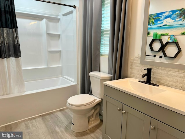 full bathroom with shower / bathtub combination with curtain, toilet, wood-type flooring, vanity, and decorative backsplash