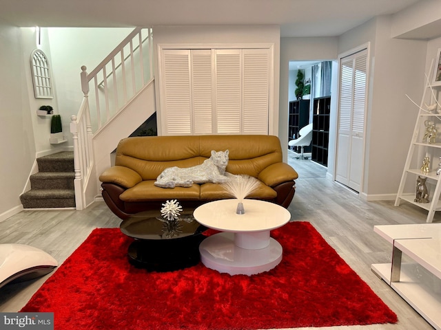 living room with light hardwood / wood-style flooring