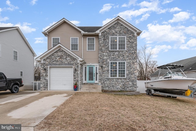 traditional home with a garage, concrete driveway, and stone siding