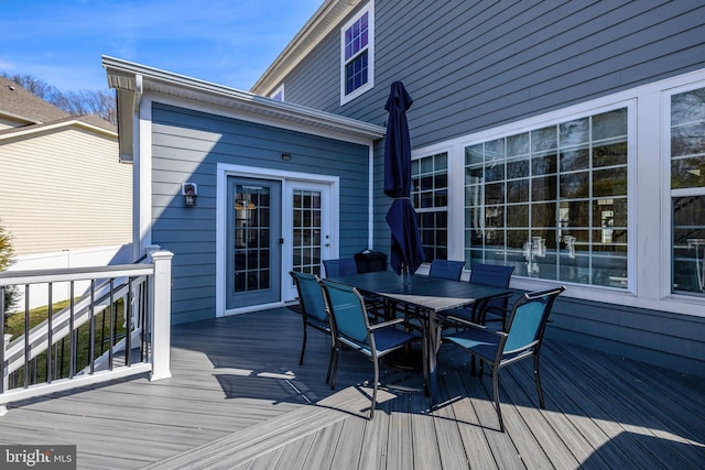 wooden deck with outdoor dining area