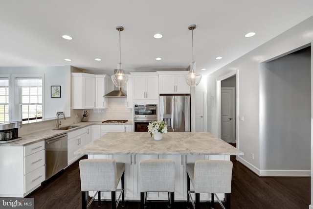 kitchen featuring tasteful backsplash, appliances with stainless steel finishes, dark wood finished floors, and a center island