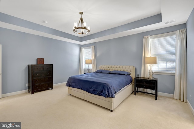 bedroom with carpet, visible vents, a chandelier, and baseboards