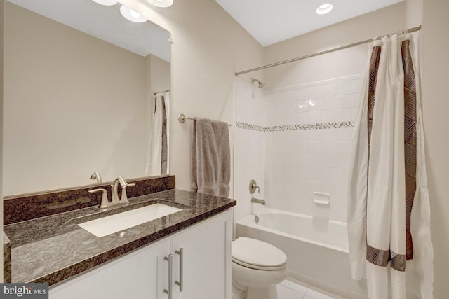 bathroom featuring shower / tub combo, vanity, and toilet