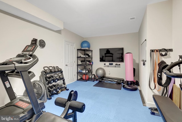 exercise room featuring baseboards and visible vents