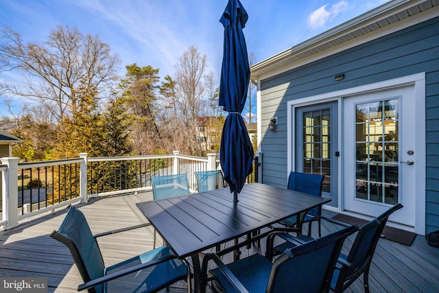 deck featuring outdoor dining area