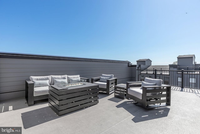 view of patio featuring an outdoor living space with a fire pit