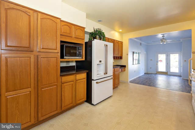 kitchen with ornamental molding, high end white refrigerator, ceiling fan, and black microwave