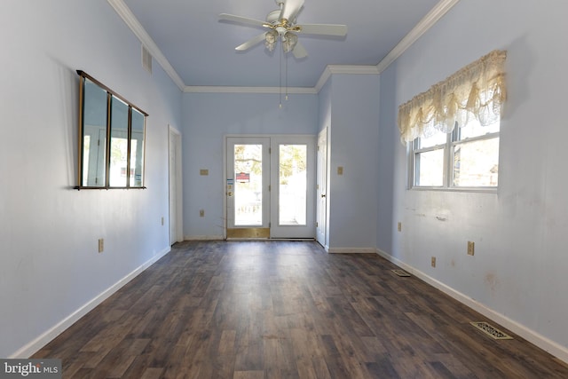 interior space featuring ceiling fan, ornamental molding, and dark wood-type flooring