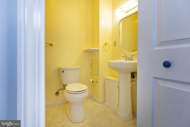 bathroom with sink and toilet