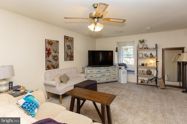 carpeted living room featuring ceiling fan