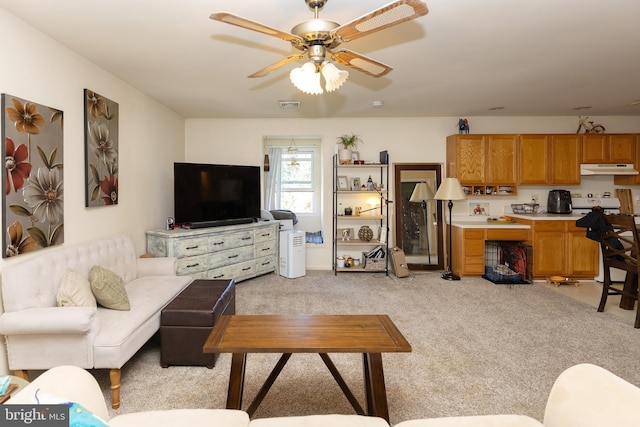 living room with light carpet and ceiling fan