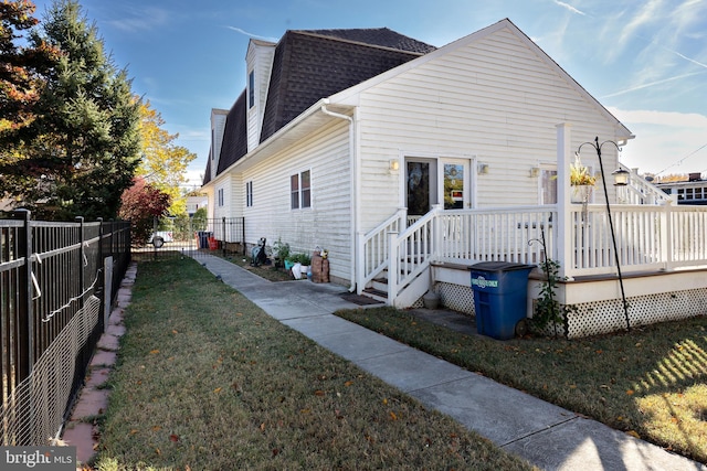 back of house with a yard