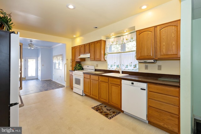 kitchen with sink, white appliances, and ceiling fan