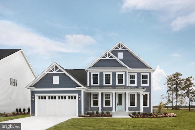 craftsman inspired home with covered porch, a garage, and a front lawn