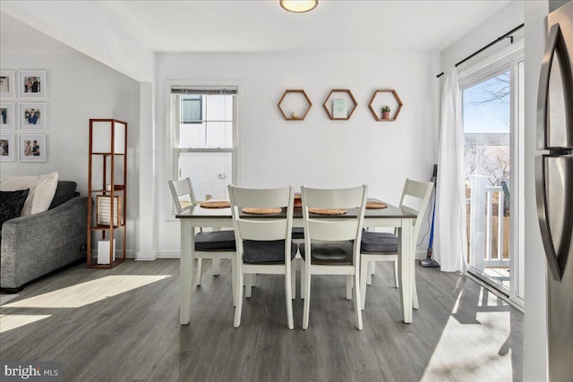 dining area with hardwood / wood-style floors