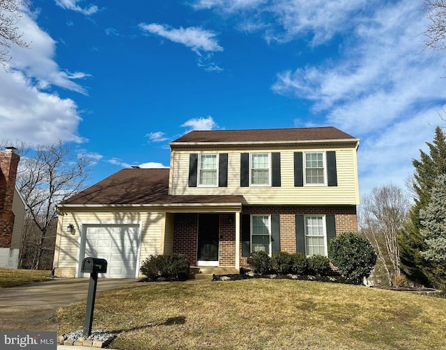 view of front of home with a front lawn and a garage