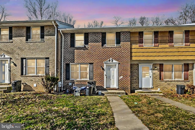 view of property with brick siding