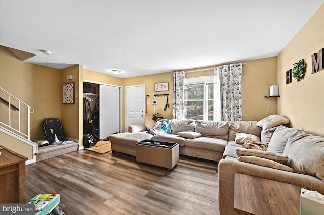 living room featuring stairway and wood finished floors