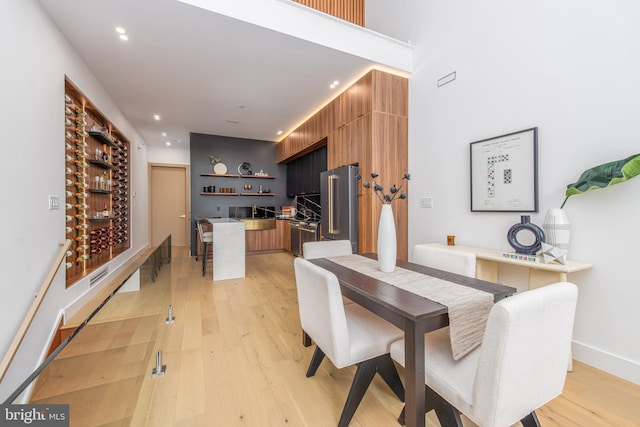 217 Tasker St, Philadelphia, PA 19148 - dining space with light wood-style flooring, baseboards, and recessed lighting