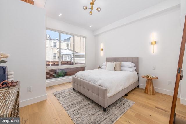 217 Tasker St, Philadelphia, PA 19148 - bedroom with a chandelier, recessed lighting, baseboards, and light wood finished floors