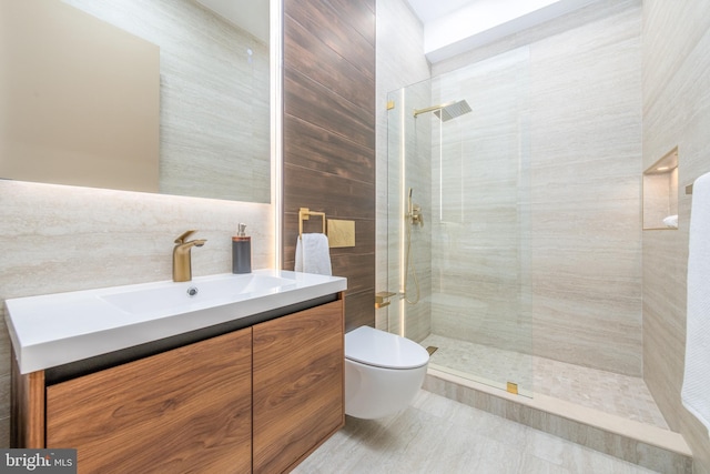 217 Tasker St, Philadelphia, PA 19148 - bathroom featuring vanity, tile walls, toilet, and walk in shower
