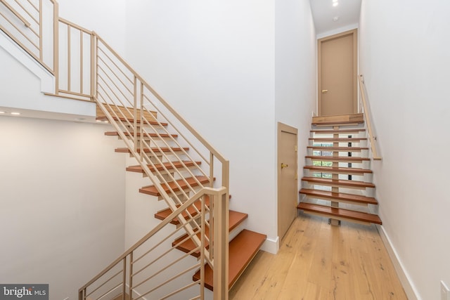 217 Tasker St, Philadelphia, PA 19148 - staircase featuring wood-type flooring and baseboards