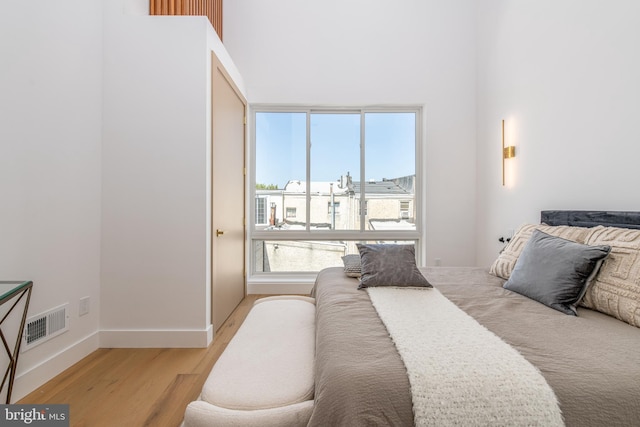 217 Tasker St, Philadelphia, PA 19148 - bedroom with baseboards, visible vents, and light wood finished floors