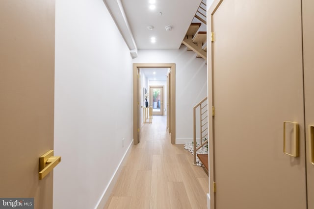 217 Tasker St, Philadelphia, PA 19148 - corridor featuring light wood finished floors, stairway, and baseboards