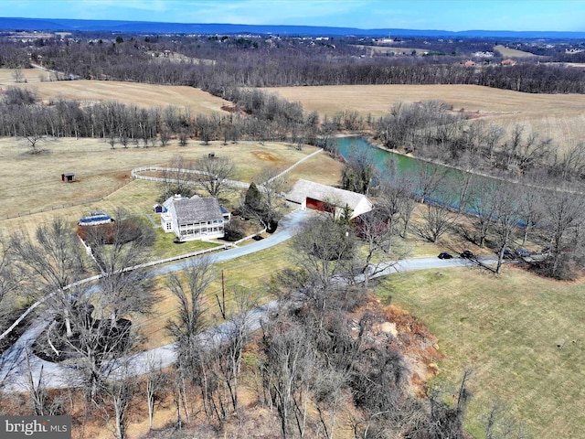 birds eye view of property with a rural view